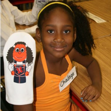 INSIGHTS in NYC Student with Hilary sock puppet