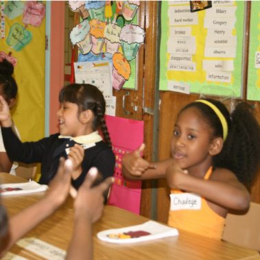 Students learning with puppets